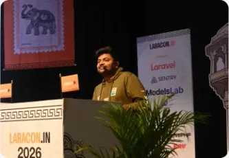 Vishal Rajpurohit speaking at a podium branded Laracon India 2026