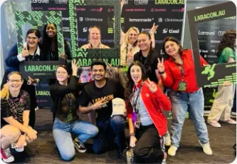 Vishal Rajpurohit in a group photo at a Laracon Australia photo booth